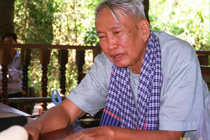 A 04 January 1998 file photo showing former Khmer Rouge leader Pol Pot talking to a journalist reportedly on in the guerrilla's jungle hide-out in Northern Cambodia. Photo: EPA
