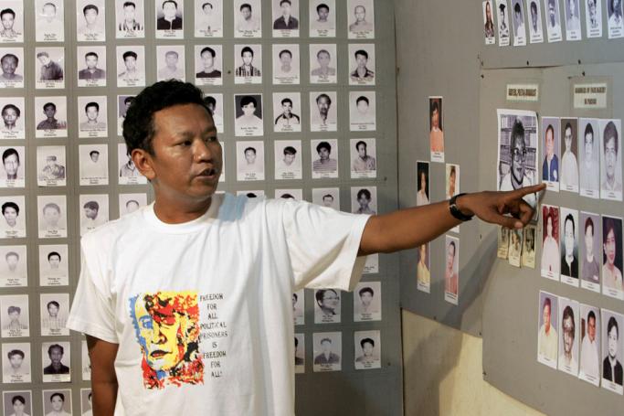 (FILES) In this file photo taken on September 26, 2007, former political prisoner Bo Kyi talks about photos of other prisoners from the 1988 Myanmar uprising at a small museum in Mae Sot, near the Thai-Myanmar border. Photo: Pornchai Kittiwongesakul/AFP