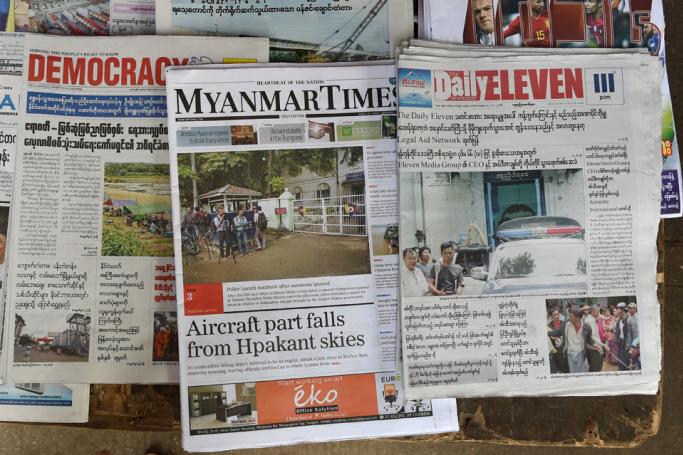 Newspapers on a news stand in Yangon. Photo: AFP