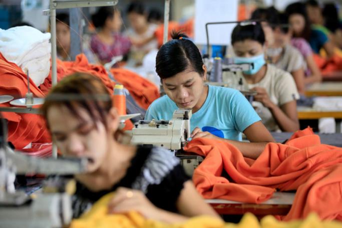 Myanmar girls work in a garment factory at Hlaing Thar Yar Industrial Zone in Yangon, Myanmar, 10 July 2015. Photo: Lynn Bo Bo/EPA
