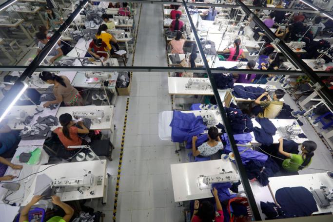 Employees work at a garment factory in Shwe Pyi Thar, Yangon. Photo: Nyein Chan Naing/EPA