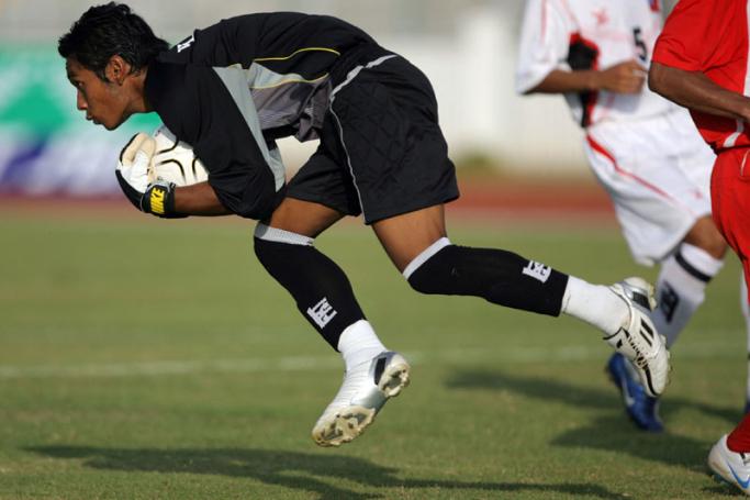 (FILES) In this file photo taken on December 11, 2007 Myanmar's goalkeeper Kyaw Zin Htet catches the ball during the men's football semi-final at the 24th Southeast Asian Games (SEA Games) against Vietnam in Korat. Photo: AFP