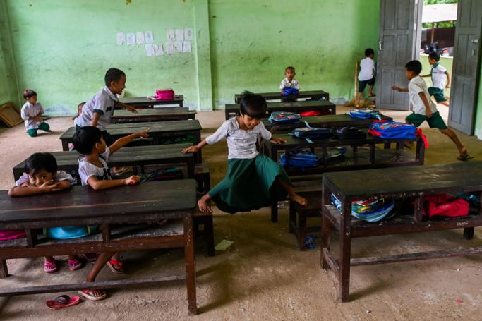 Students play in their classroom of a government school on the outskirts of Yangon. Photo: Ye Aung Thu/AFP