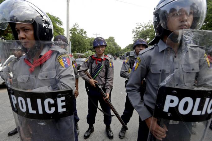 Hate speech and social media posts led to conflict - Riot police block a road in Mandalay, Myanmar, 04 July 2014. One Buddhist and one Muslim were killed and 14 people injured in two nights of clashes. The violence followed allegations that two Muslim brothers who own a teashop raped a Buddhist female member of staff. Photo: EPA