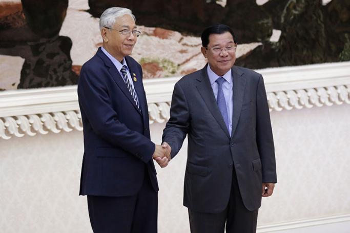 Myanmar's President Htin Kyaw (L) shakes hands with Cambodian Prime Minister Hun Sen (R) during his arrival at the Peace Palace in Phnom Penh, Cambodia, 04 February 2017. President Htin Kyaw is on an official four-day visit to Cambodia to strengthen bilateral ties and cooperation between the two countries. Photo: Mak Remissa/EPA
