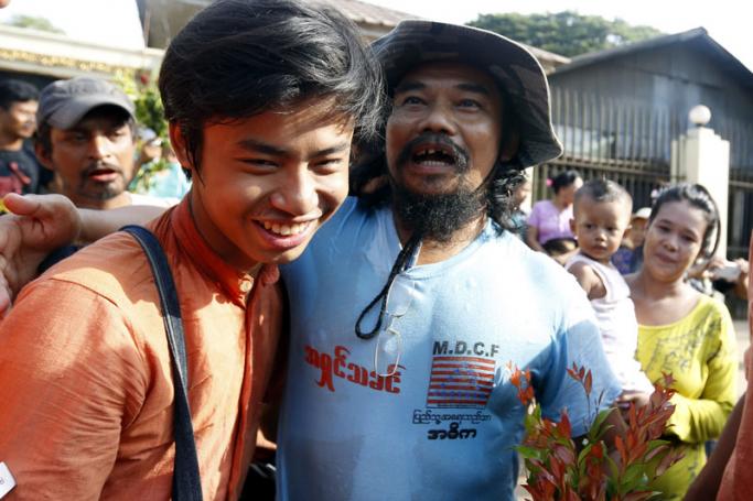Htin Kyaw (R), director of the Movement for Democracy Current Force (MDCF), a community-based organisation working to promote development and democracy in Myanmar, is reunited with his friends after his release from Insein prison in Yangon, Myanmar, 17 April 2016. Photo: Nyein Chan Naing/EPA
