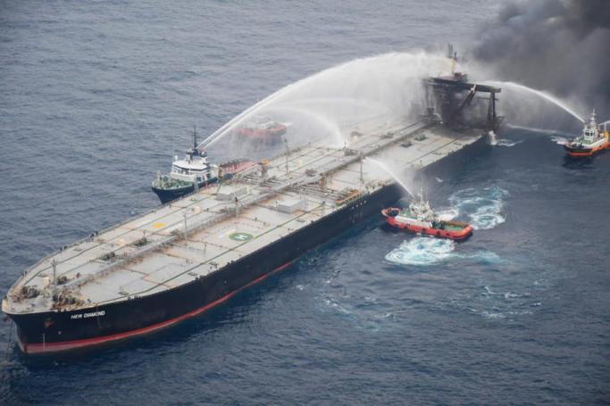 A handout photo made available by the Sri Lankan Air Force Media office shows coast guard ships and fireboats battling to extinguish the fire from the Panama-flagged crude oil vessel 'MT New Diamond' off the east coast of Sri Lanka, 08 September 2020. Photo: EPA