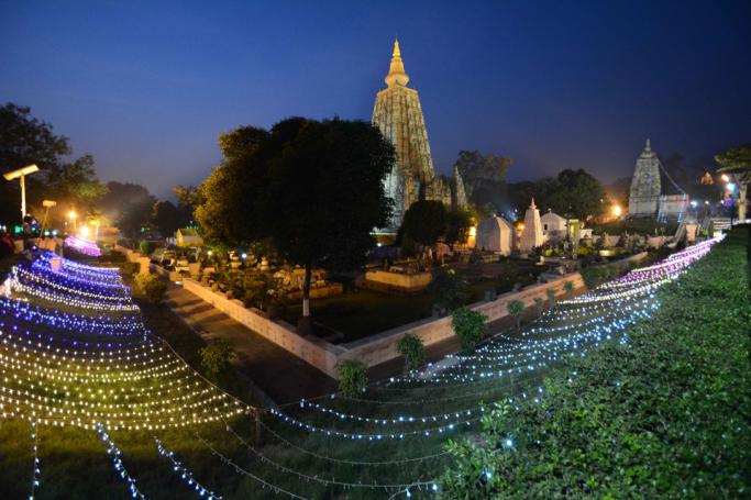 (File) The Mahabodhi temple is illuminated with lights on the occassion of 10th Tipitaka Chanting for World Peace in Bodhgaya on December 10, 2014. Photo: AFP