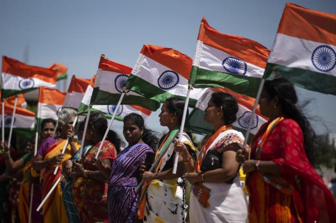 Supporters of the Bharatiya Janata Party (BJP) hold the tricolored flags during a boat rally to celebrate the 75th Independence Day of India, at Neelangarai beach, in Chennai, India, 10 August 2022. Photo: EPA