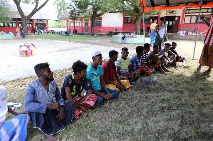 Rohingya refugees wait for an identification process by the local police at their temporary shelter provided by Aceh local Government in Pidie, Aceh, Indonesia, 28 December 2022. Photo: EPA