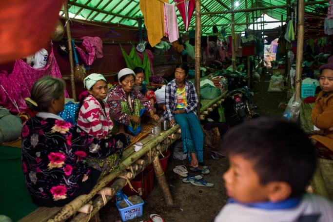 Internally displaced people wait in a temporary shelter in Danai, Kachin state, on May 12, 2018. Photo: Ye Aung Thu/AFP
