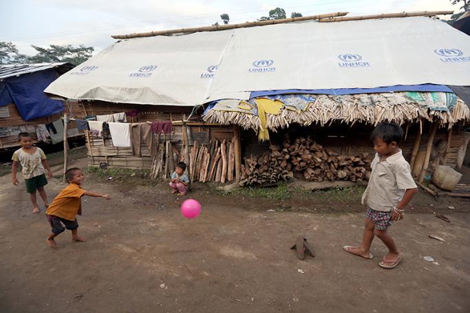Kachin children play inside the Je Yang Internally Displaced People (IDP) camp, Kachin State, Myanmar. Photo: Nyein Chan Naing/EPA
