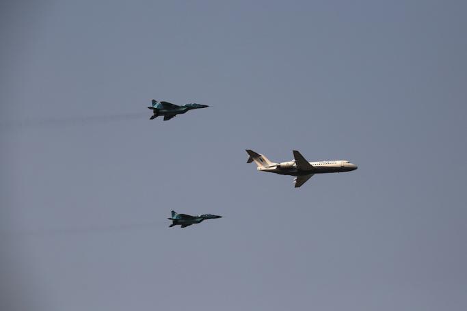 (File) Myanmar Air Force fighter jets accompany an airplane during a display to celebrate Myanmar's 77th Armed Forces Day in Naypyidaw on March 27, 2022. Photo: AFP