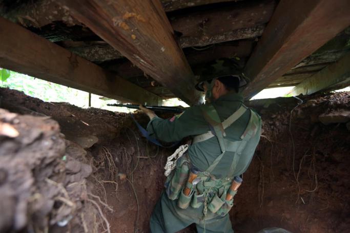 A soldier from the Kachin Independence Army (KIA) takes position in a bunker near the Laja Yang front line in Laiza, Kachin state. Photo: Nyein Chan Naing/EPA
