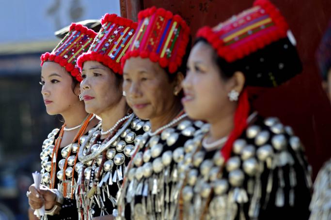 Kachin women in traditional dress perform a dance as they welcome ethnic leaders at the Ethnic Armed Organizations Conference in Laiza, Kachin State, Myanmar, 2 November 2013. Photo: Nyein Chan Naing/EPA
