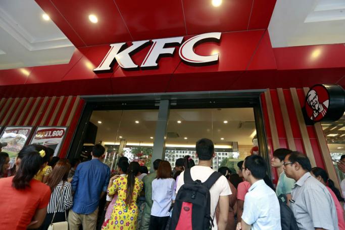 Another KFC branch opens - People queue outside the KFC first branch restaurant in Yangon, Myanmar, 30 June 2015. Photo: Nyein Chan Naing/EPA
