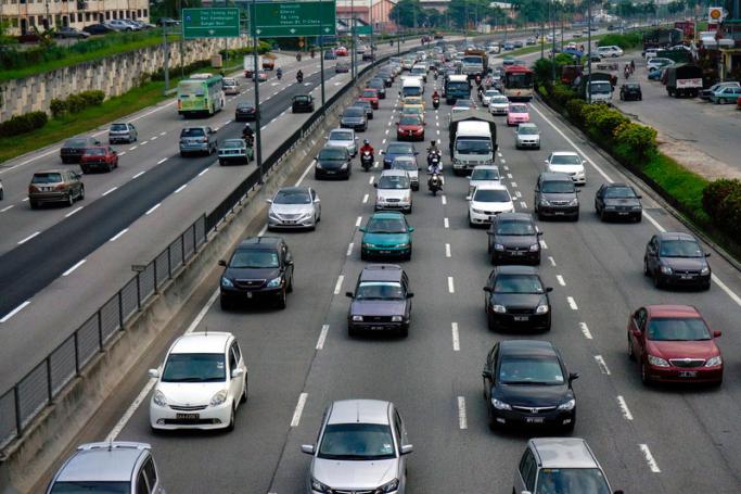 Cars move slowly during morning rush hour in Kuala Lumpur, Malaysia. Photo: EPA
