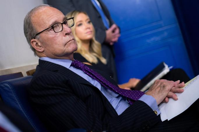 Larry Kudlow, Director of the United States National Economic Council, listens as US President Donald J. Trump holds a press briefing at the White House in Washington, DC, USA, on 14 August 2020. Photo: EPA