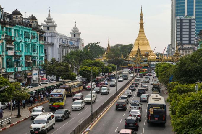 Traffic is seen on Mahabandoola road, with the Sule pagoda in the background, in central Yangon. Photo: Romeo Gacad/AFP
