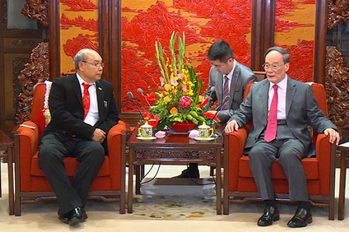 Amyotha Hluttaw Speaker Mahn Win Khaing Than, left, meets with Vice President of the People’s Republic of China Wang Qishan in Beijing yesterday. Photo: Myanmar News Agency
