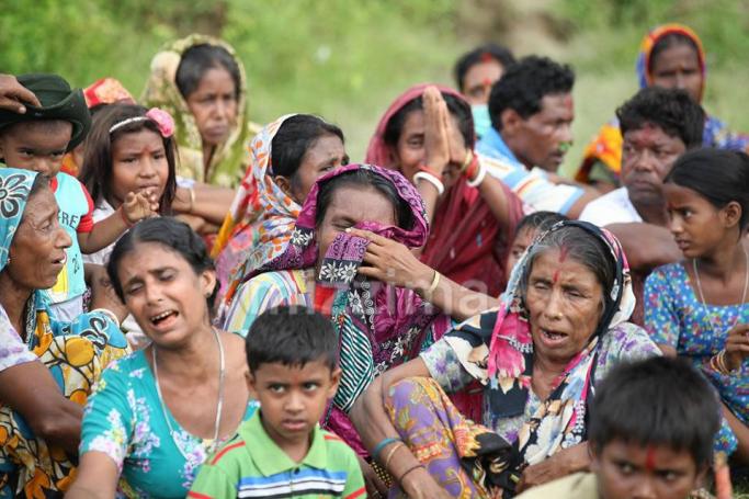 Villagers crying at the site where the bodies were found. Photo: Thura for Mizzima
