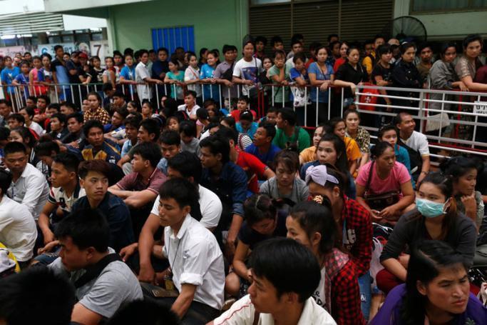 File) Migrant workers queue in a registration line during a migrant laborer registration drive at a government One Stop Service Center for labor and immigration in Samut Sakhon province, Thailand. Photo: Rungroj Yongrit/EPA