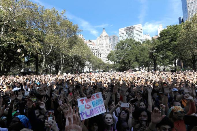 Protesters react as US rapper Jaden Smith preforms at the Youth Climate Strike in Battery Park in New York, New York, USA, 20 September 2019. An estimated quarter of a million people marched in New York to protest government inaction on the climate crisis. Photo: Peter Foley/EPA
