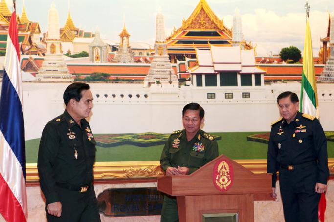 Myanmar Commander-in-Chief Senior General Min Aung Hlaing (C) stands next to Thai army chief and junta head General Prayut Chan-o-cha (L) and the supreme commander of the military General Tanasak Patimapragorn (R) during a meeting at the Royal Thai Army headquarters in Bangkok, Thailand, 04 July 2014. Photo: EPA
