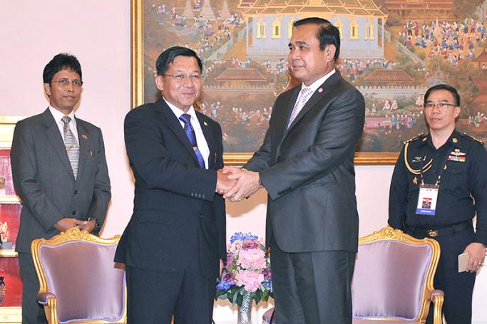 Myanmar Defence Forces Commander-in-Chief Senior General Min Aung Hlaing (C-L) greeted by Thai Prime Minister Prayut Chan-o-cha (C-R) during a meeting at Government House in Bangkok, Thailand, 27 August 2015. Photo: Thai government/EPA
