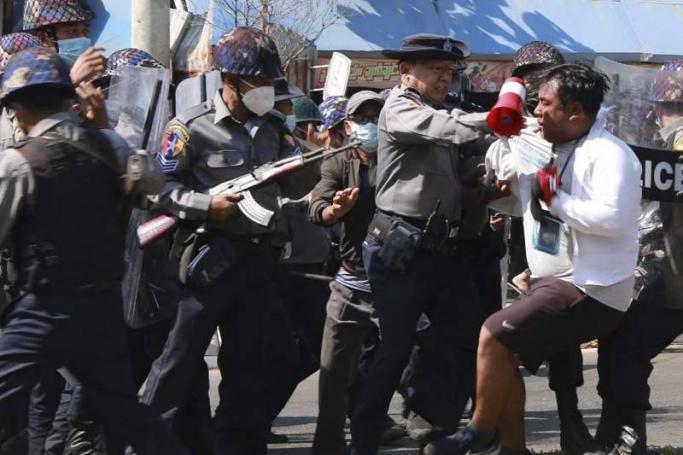 File Photo: Police arrest a protester during a demonstration against the military coup in Mawlamyine, in Myanmar on February 2021