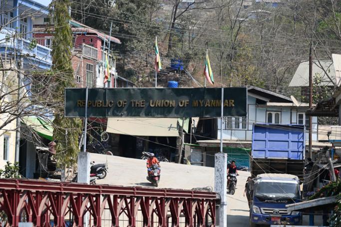Residents are seen on the Myanmar's side near the border between India and Myanmar at Zokhawthar in the India's northeastern state of Mizoram on March 15, 2021. Photo: Sajjad Hussain/AFP