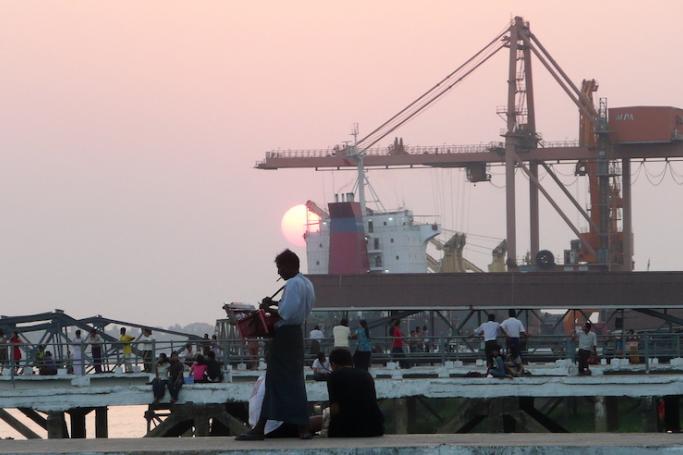 A Myanmar man selling his products at a pier at the Bo Ta Htaung Port in Yangon. Photo: AFP