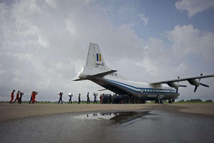 (FILES) This file photo taken on August 5, 2015 shows a Myanmar Air Force Shaanxi Y-8 transport aircraft being unloaded at Sittwe airport in Rakhine state, similar to the aircraft carrying over 100 people that went missing between the southern city of Myeik and Yangon on June 7, 2017. Photo: Ye Aung Thu/AFP
