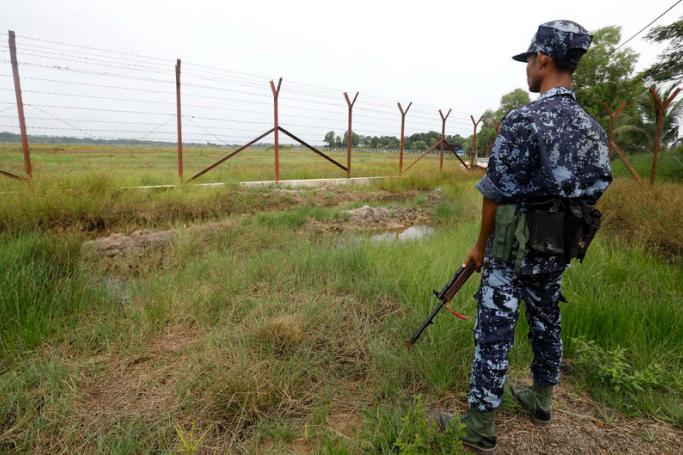 A Myanmar border guard police stands guard at the Bangladesh-Myanmar border in Maungdaw district, Rakhine State. Photo: EPA