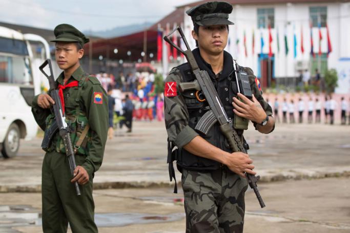 (File) This photo taken on July 28, 2016 shows two Myanmar armed rebels from the Kachin Independence Army (KIA) securing the compound (behind) where Myanmar ethnic rebel leaders and representatives have gathered for a four-day summit in Mai Ja Yang, the KIA controlled town in northern Kachin state. Photo: AFP