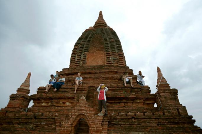Foreign tourists flocking to view the sunrise at an ancient pagoda in Bagan city, Myanmar. Photo: Rungroj Yongrit/EPA
