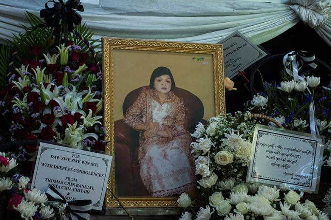 A potrait photograph of late Myanmar famous fortune teller Swe Swe Win, known as ET is displayed during the funeral service at the cemetery in Yangon on September 12, 2017. Photo: Ye Aung Thu/AFP
