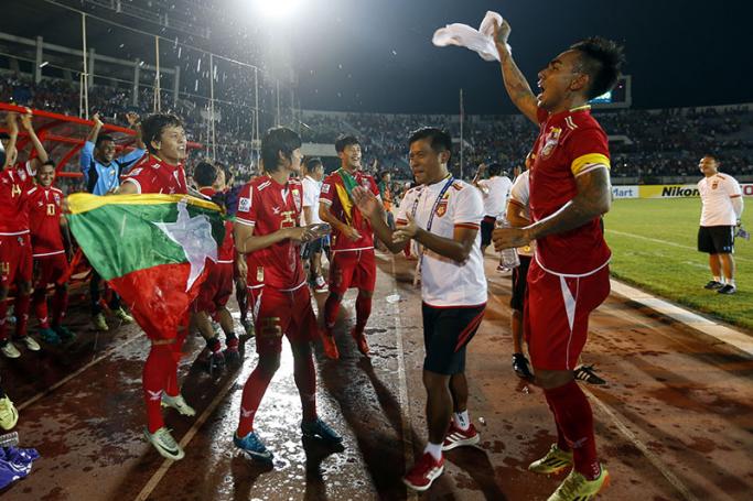 Myanmar football team celebrate after they win the match with Malaysia team during the AFF Suzuki Cup Group B soccer match in Thuwanna Football statdium in Yangon, Myanmar, 26 November 2016. Photo: Nyein Chan Naing/EPA
