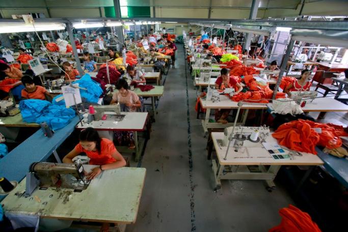 Myanmar girls work in a garment factory at Hlaing Thar Yar Industrial Zone in Yangon, Myanmar, 10 July 2015. Photo: Lynn Bo Bo/EPA
