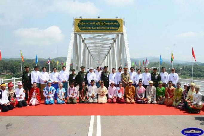 The Myanmar and Lao entourages, including President U Thein Sein, pose at the bridge. Photo: President's Office

