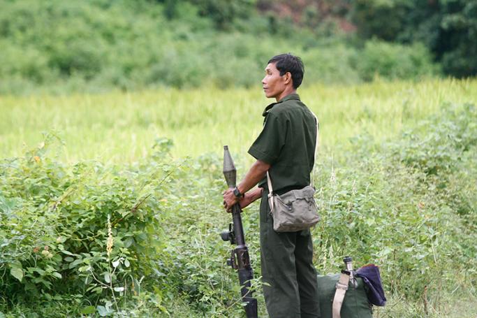 Myanmar soldier holds an RPG as he ensures security on the road along Kyee Ken Pyin police border guard post near Maungdaw town, Rakhine State, western Myanmar, 13 October 2016. Photo: Nyunt Win/EPA
