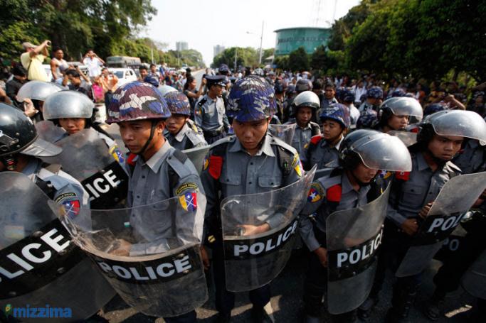 Myanmar Police block the road as they halt student protesters in Yangon on 10 March 2015. Photo: Mizzima
