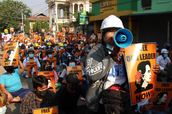 Demonstrators hold banners calling to release Myanmar's ousted leader Aung San Suu Kyi as they facing police officers during a protest against the military coup in Pyinmana township, Naypyitaw, Myanmar, 04 March 2021. Photo: MAUNG LONLAN/EPA