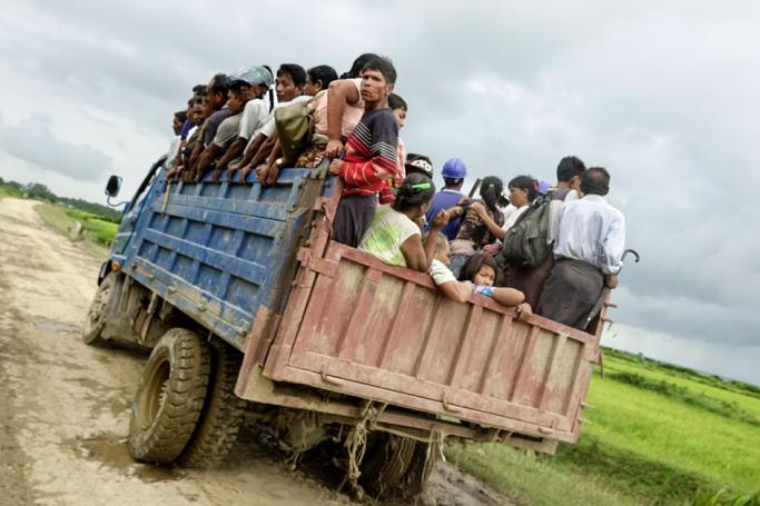 Residents ride a truck as they leave an area close to fighting to seek safe place at Rathedaung township of northern Rakhine State, western Myanmar, 25 August 2017. Photo: Nyunt Win/EPA
