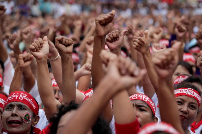 People raise their hands as they gather in front of Yangon City Hall during a rally in support of amending to the 2008 constitution of Myanmar, Yangon, Myanmar, 17 July 2019. Photo: Lynn Bo Bo/EPA