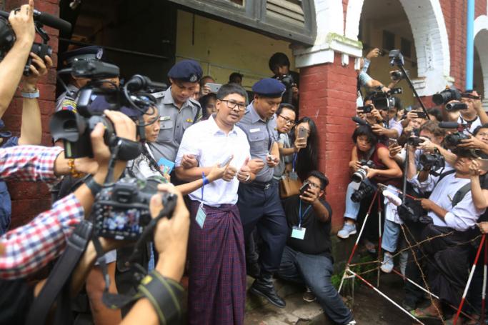 Reuters journalist Wa Lone talks to media as he leaves Insein township court, in Yangon, Myanmar, 27 August 2018. Photo: Thet Ko/Mizzima