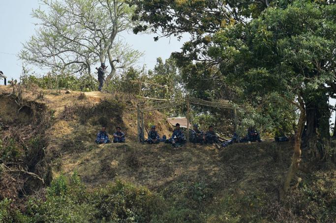 Myanmar security personnel keep watch along the Myanmar-Bangladesh border near Tombru in the Bangladeshi district of Bandarban on March 1, 2018. Photo: Munir Uz Zaman/AFP
