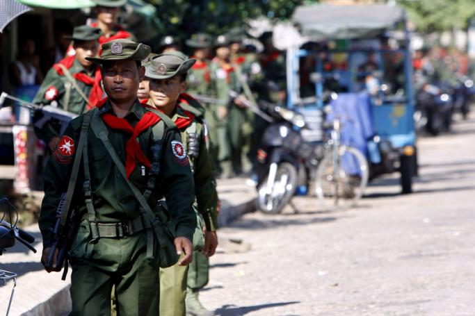(File) A long line of Myanmar soldiers, arriving back from the unrest area in Rakhine state, march in Sittwe city, capital of Rakhine State, Myanmar, 31 October 2012. Photo: Nyein Chan Naing/EPA