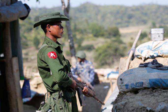 A Myanmar solidier mans his station at the Goke Pi police outpost, in Buthidaung Township, northern Rakhine State, western Myanmar, 07 January 2019. Photo: Hein Htet/EPA