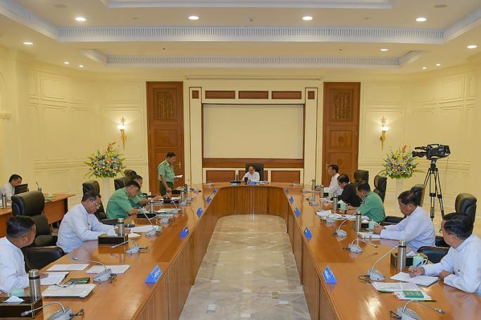This handout photograph taken and released by the Myanmar's Military Information Team on July 31, 2023, shows Min Aung Hlaing (5L) Myanmar's military chief speak during a defense and security council meeting in Naypyidaw. Photo: AFP